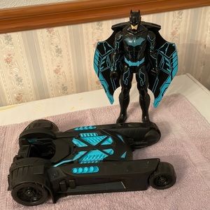 Batman with car and I guess a boat